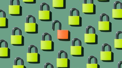 an red, unlocked padlock in a sea of locked, green padlocks.