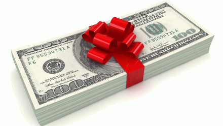 A stack of $100 bills wrapped in a red bow.